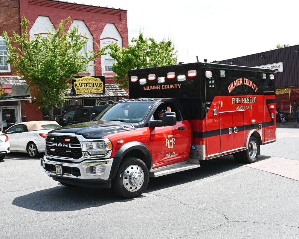 Gilmer County Fire/Rescue ambulance driving through downtown Ellijay
