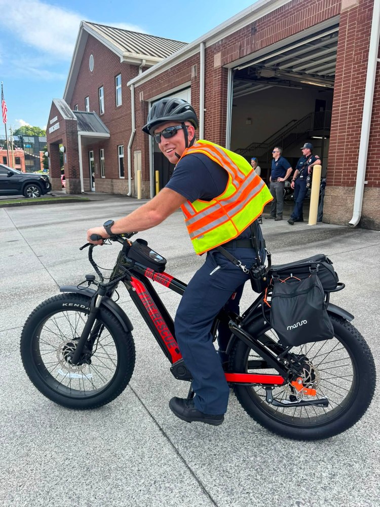 Gilmer County Fire/Rescue member on an e-bike patrol unit outside the station