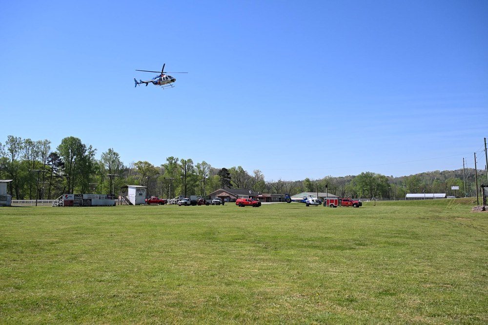 Air medical helicopter and Gilmer County Fire/Rescue units at a landing zone