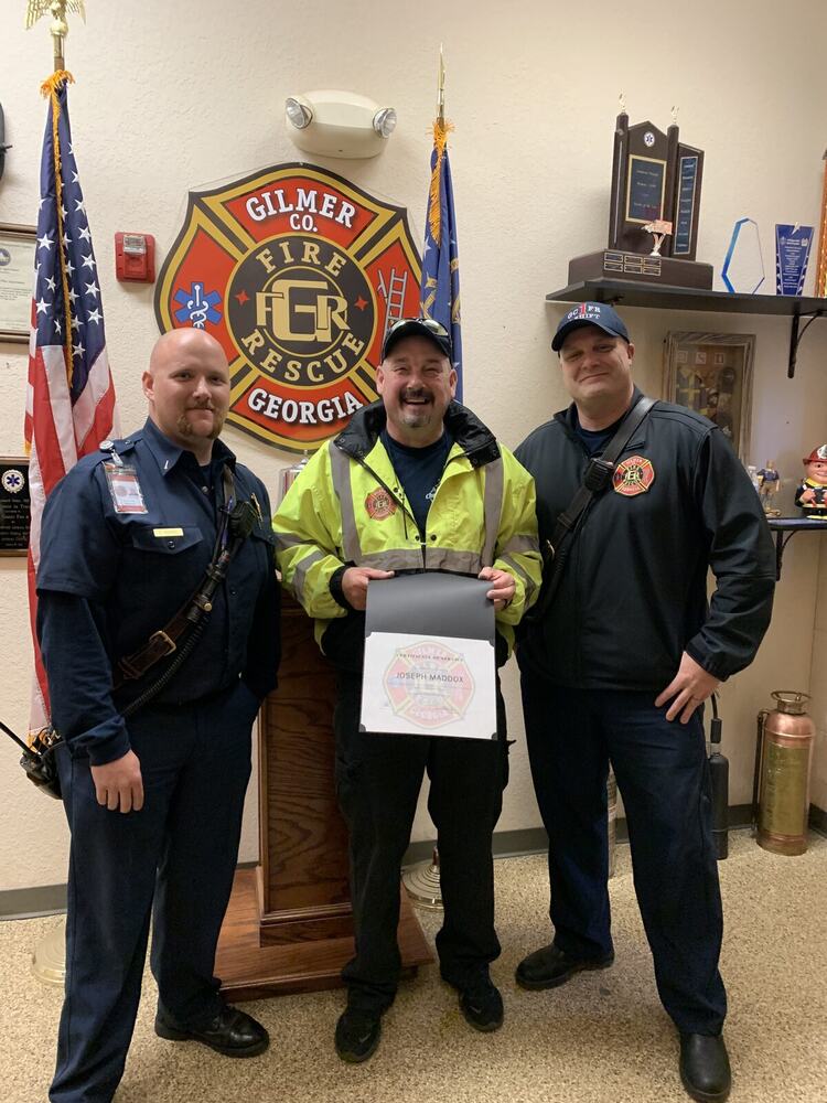 Eric Maddox receiving a certificate of service at Gilmer County Fire Rescue headquarters