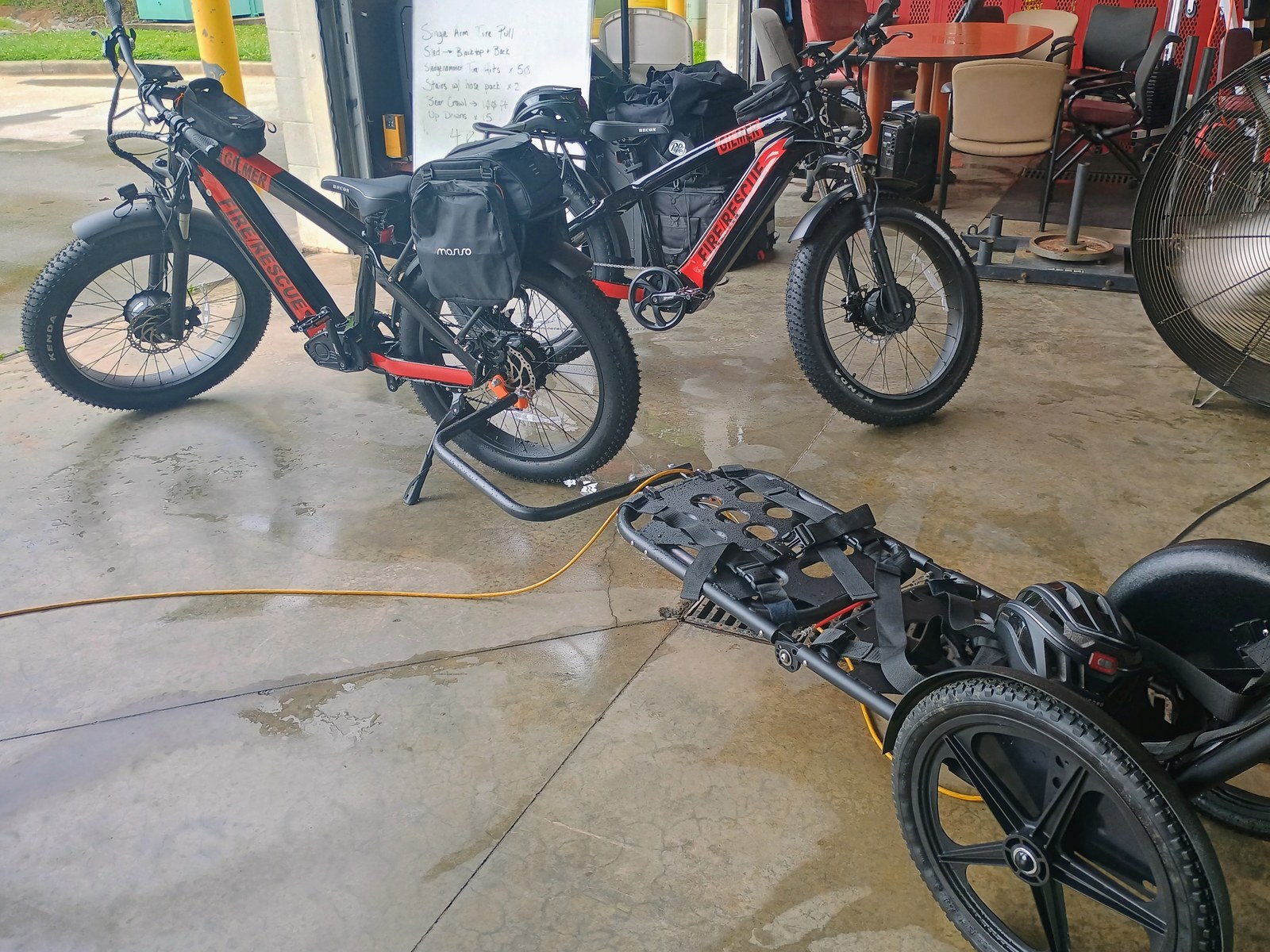 Gilmer County Fire/Rescue e-bikes and a wheeled rescue sled staged at the station