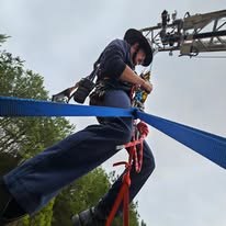 Close-up of a Gilmer County Fire/Rescue member rappelling during rope rescue training